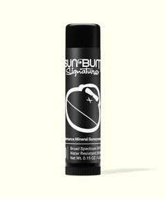 Sun Bum Signature lip balm with black packaging featuring white logo and text against a light background