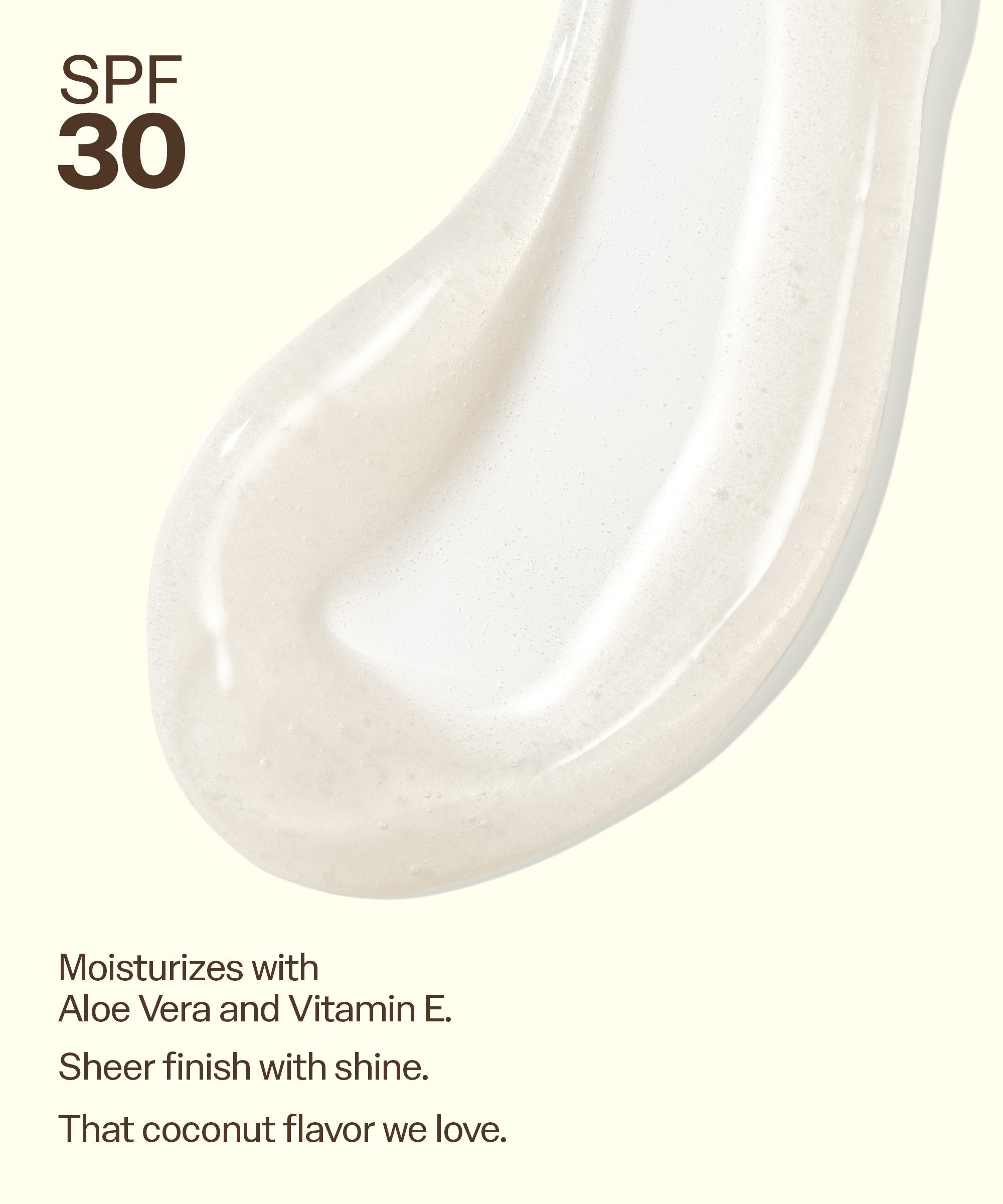 Close-up of Sun Bum Clear SPF 30 Moisturizing Lip Balm texture highlighting aloe vera, vitamin E, and a coconut flavor.