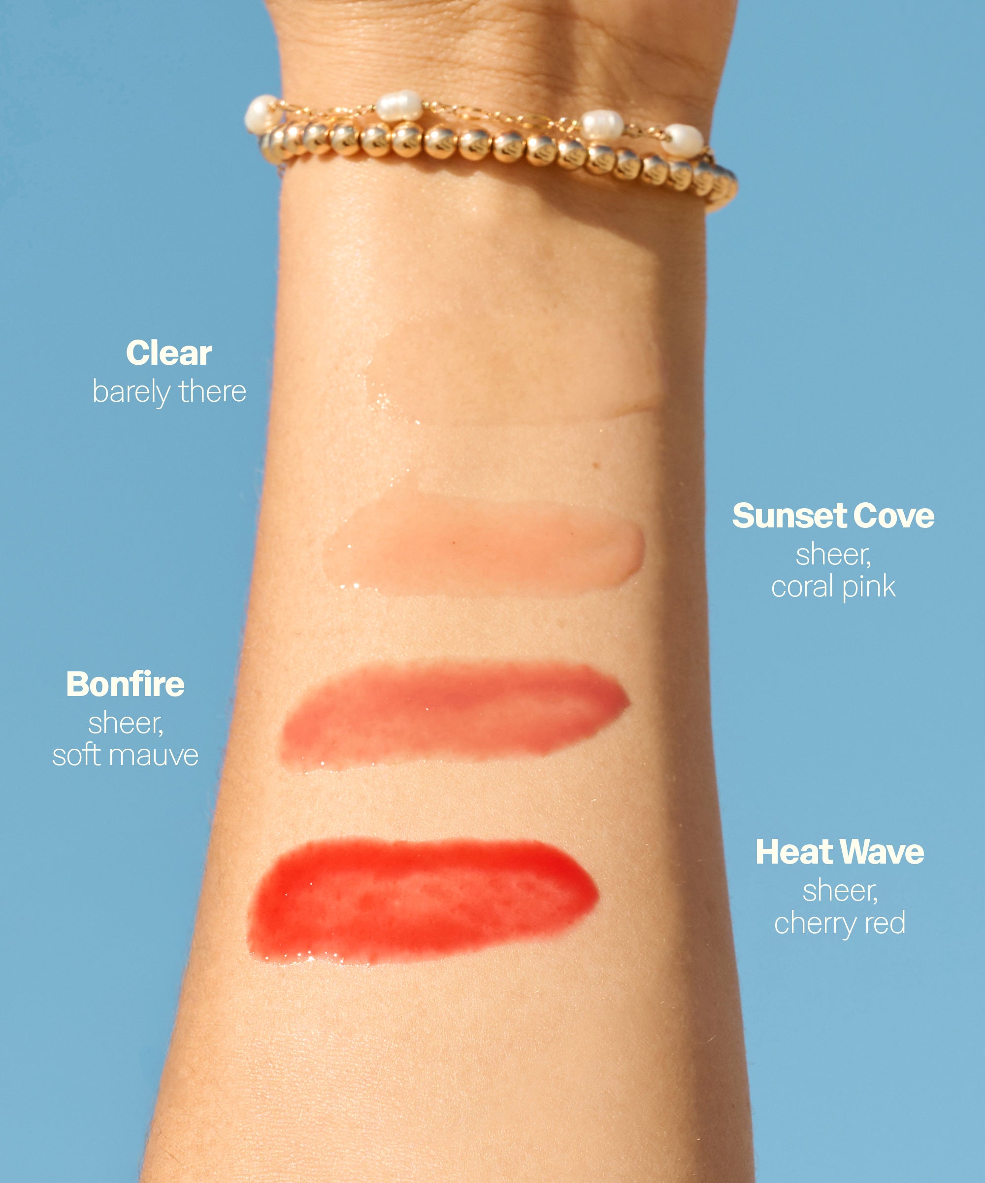 Arm swatch of Sun Bum Heat Wave SPF 30 Moisturizing Lip Balm in sheer cherry red shade on skin.