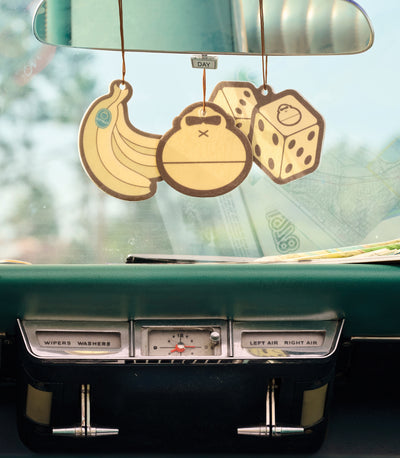 3 Air Fresheners hanging from a reerveiw mirror