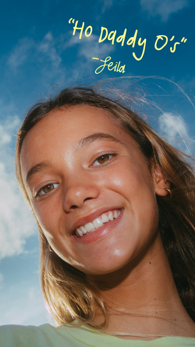 Woman smiling with a blue sky and clouds in the background, featuring text 'Ho Daddy O's' and 'Leila'.