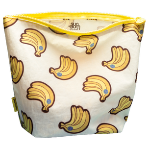 Reusable snack bag with banana pattern and yellow zipper, featuring the Sun Bum brand.